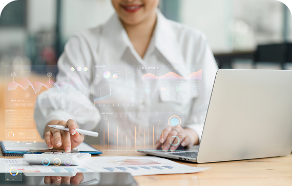 Person analyzing data with laptop and tablet.