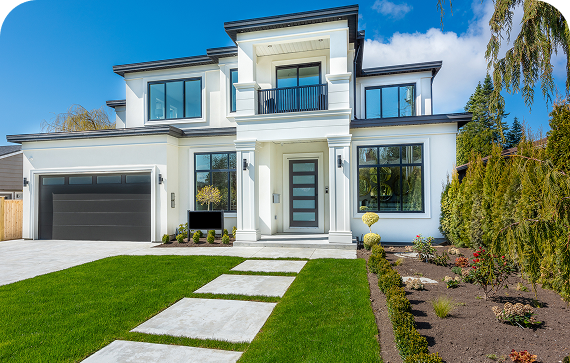 Modern two-story house with green lawn.